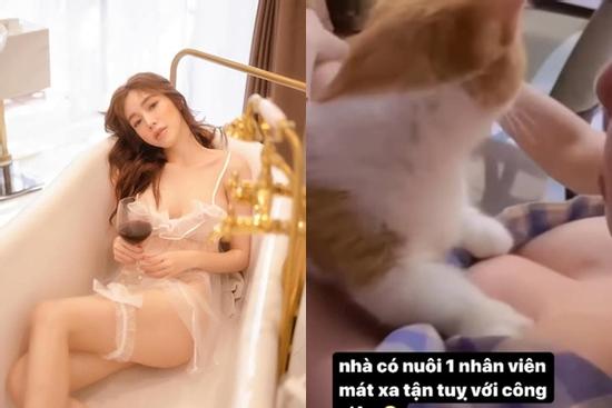 Elly Trần khoe cảnh cho mèo cưng massage vòng 1 'ngồn ngộn'