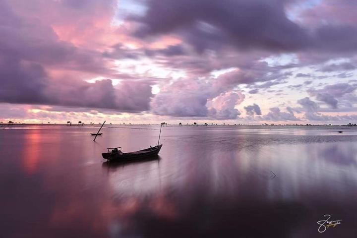 Bãi biển hoang sơ ở Thái Bình với những chòi canh ngao thơ mộng-1