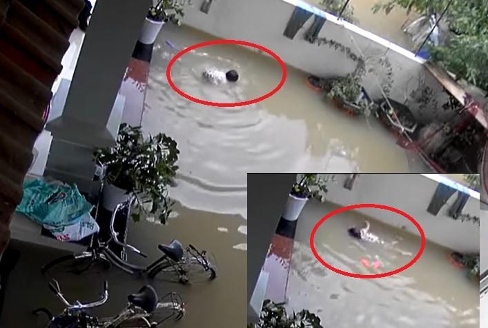 Clip: Thót tim nhìn em bé vùng vẫy khi rơi xuống nước ngập-2