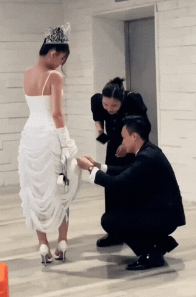 Lê Âu Ngân Anh được chồng cúi người chỉnh váy giúp giữa nghi vấn mang thai-3