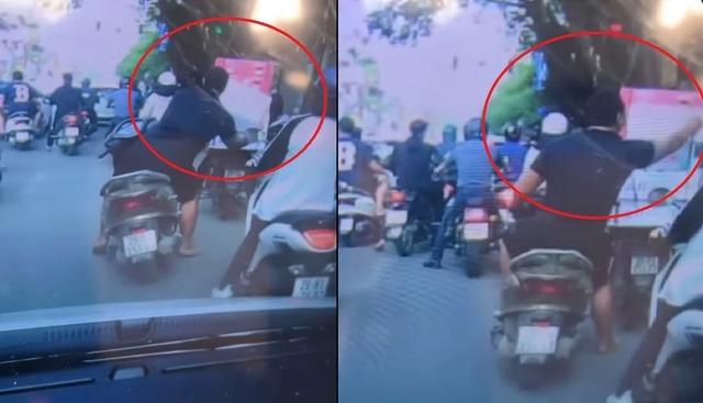 Video: Ngang nhiên bắt chim giữa phố ở Hà Nội, người đàn ông cười tươi rói trước khi rời đi-1