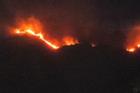 Trận 'mưa vàng' dập tắt hoàn toàn đám cháy lớn trên núi Cô Tiên