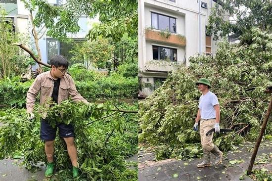 NSND Xuân Bắc cùng 2 con trai hỗ trợ dọn cây đổ trên phố sau bão Yagi
